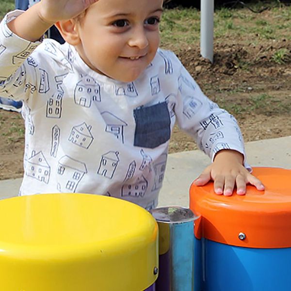 Boys Playing Outdoor Musical Drums