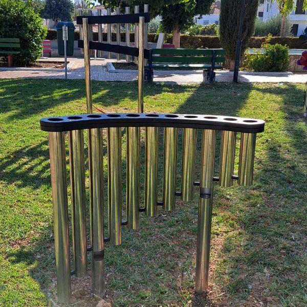 Outdoor musical instrument made of  silver pipes with holes on top to play with your hands