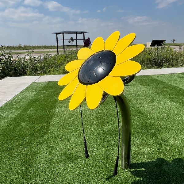 an outdoor drum shaped like a large sunflower in the Kansas Wetlands Center new musical garden