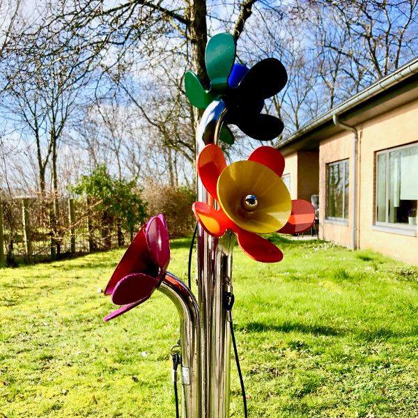 A posy of brightly coloured outdoor musical flowers installed outside a care home in Denmark for residents and passer bys to play on