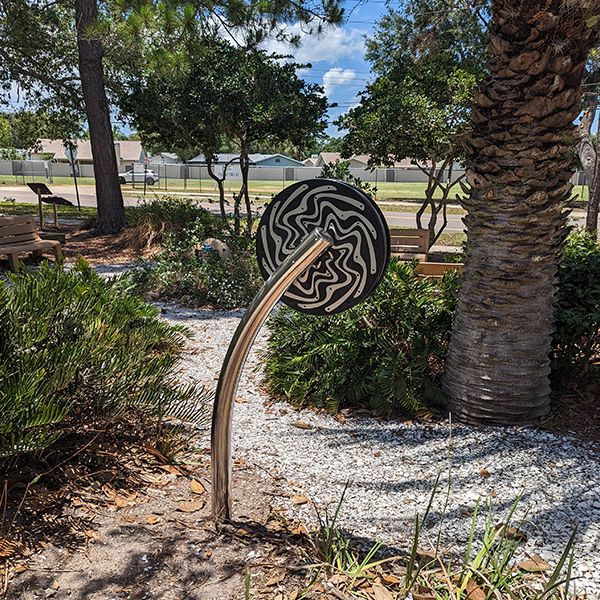 image of a cyclone rain making instrument on a stainless steel stand