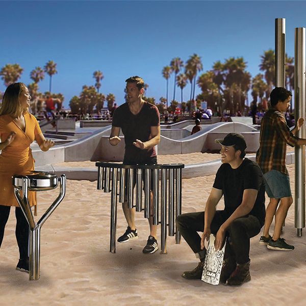 picture of adults playing outdoor musical instruments on a beach