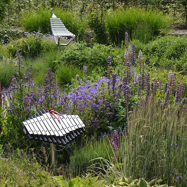 two outdoor musical insrtuments amongst the plants in a sensory garden in castle grounds