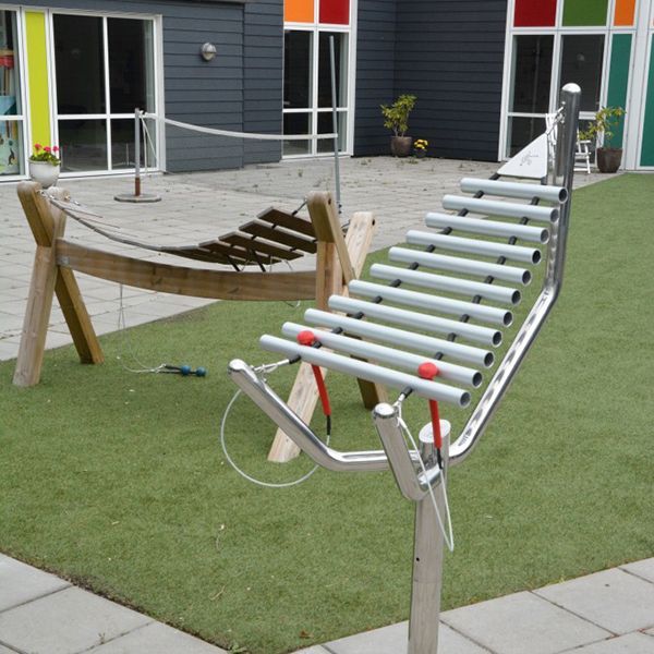 Two large musical instruments in courtyard garden of children's hospital