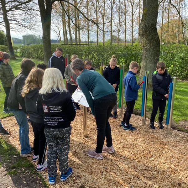 pupils playing their new outdoor musical instruments in a danish school