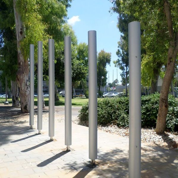 six large outdoor musical chimes installed on the street outside tel aviv music centre