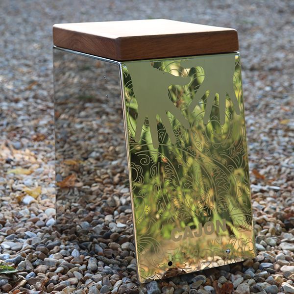 a stainless steel outdoor cajon drum with a wooden seat for musical parks and playgrounds