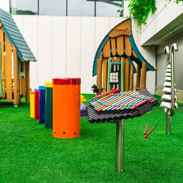 outdoor xylophone and outdoor drums and bell lyre instrument in school playground 