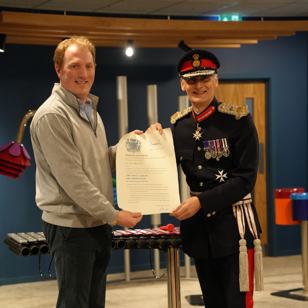 Percussion Play Director Jody Ashfield being presented with a certificate from HM Lord-Lieutenant Nigel Atkinson Esq