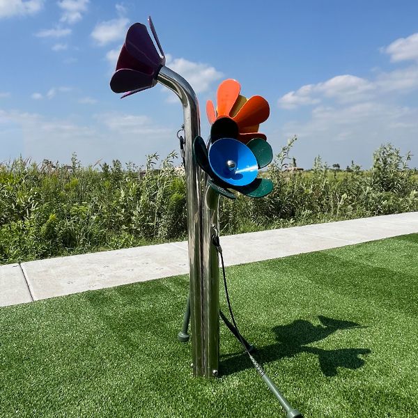 an outdoor musical instrument made to look like flowers in the Kansas Wetlands Center new musical garden