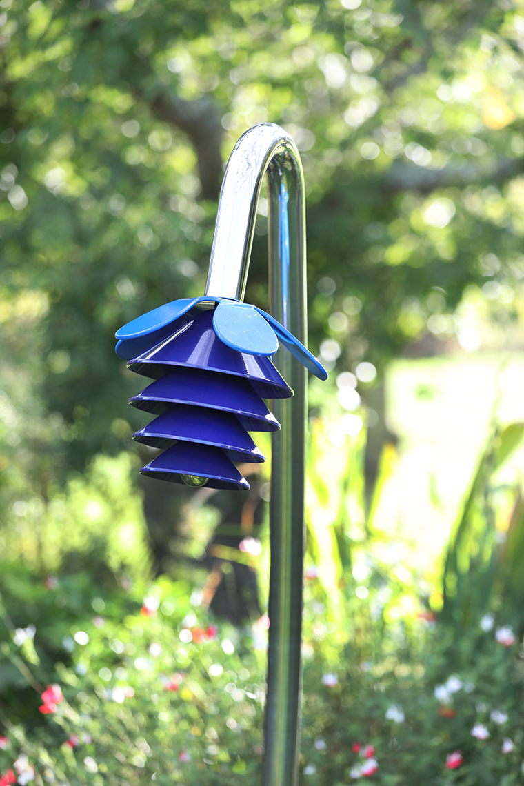 An outdoor musical flower comprising four bells and a petal on a stainless steel 'stalk' for playgrounds and sensory gardens