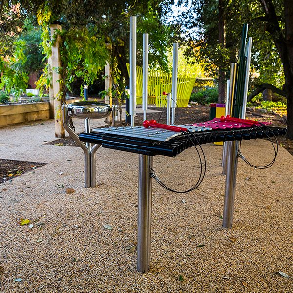 a selection of outdoor musical instruments in the sensory garden at Aldeburgh Hospital