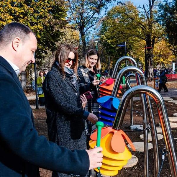 image ofadults playing outdoor musical flowers  in the new sensory park at the Prof. Dr. Alexandru Obregia Psychiatric Hospital in Bucharest 