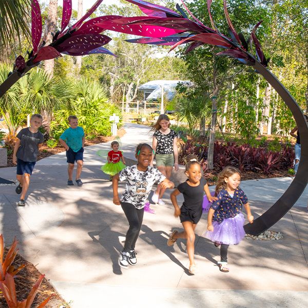 Children running into the Florida Botanical Gardens new sensory play area