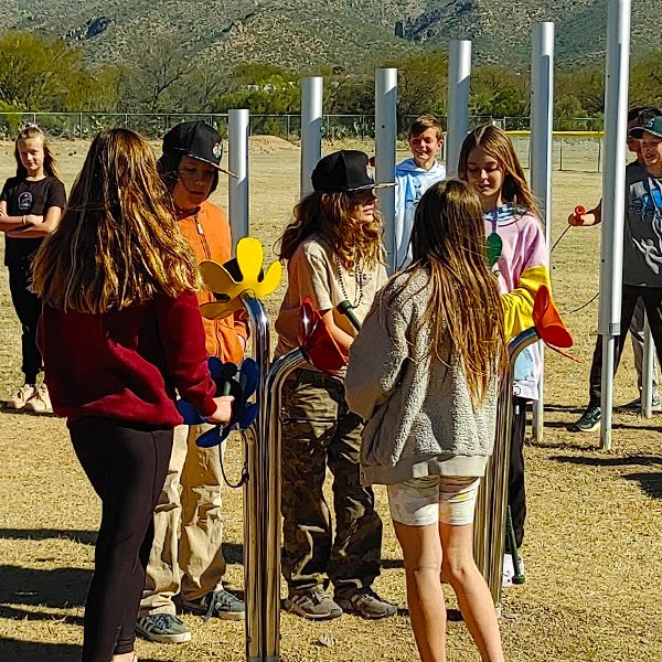 pupils from Tanque Verde School playing large outdoor musical instruments in their new outdoor music classroom