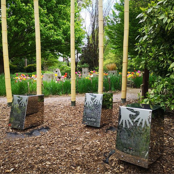 three stainless steel outddor cajon drums in the grounds of sir harold hilliers gardens