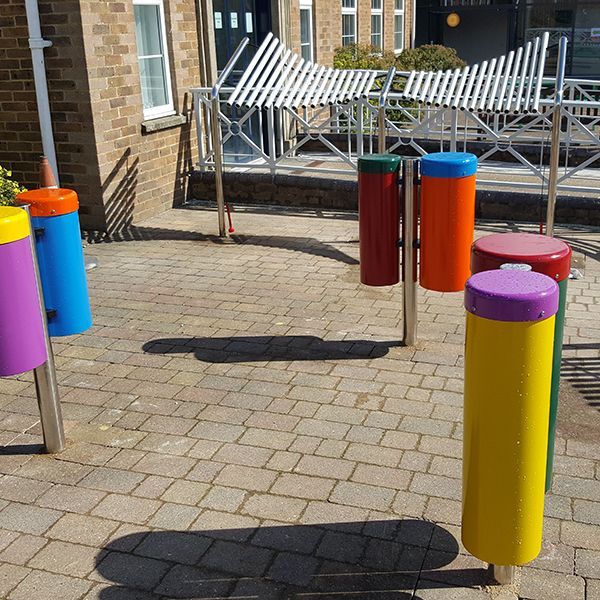 special needs school playground with outdoor musical instruments installed