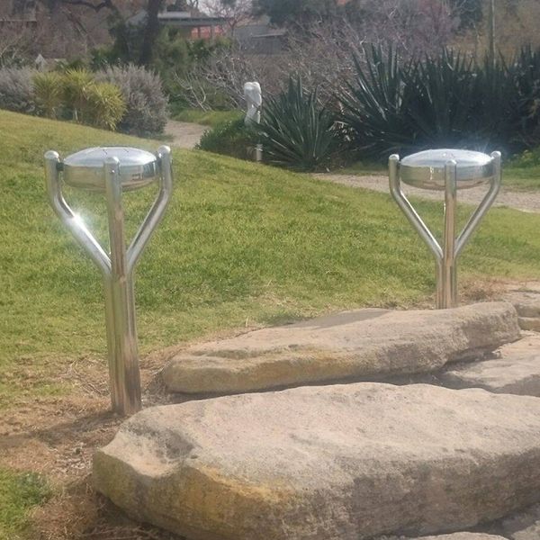 two stainless steel tongue drums installed overlooking the sea in kibbutz