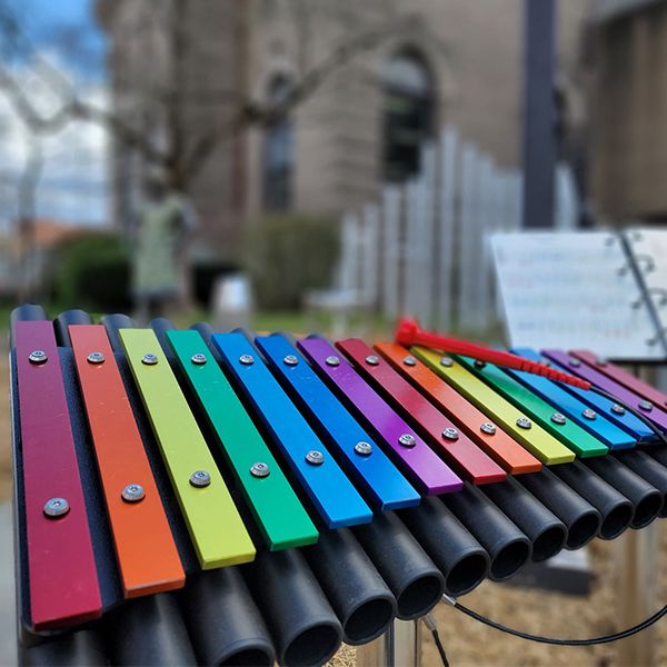 large colorful outdoor xylophone installed outside the oil city public library