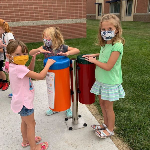 children playing on the Hastings Noon Kiwanis recently completed outdoor musical playground in the Adams Central Elementary School Playground