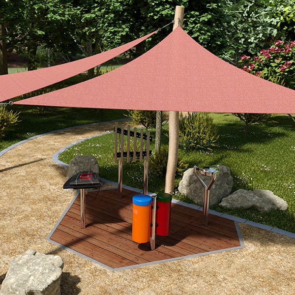 Colorful outdoor music station with a red shade sail, xylophone, and cylindrical drums, set in a lush garden path.