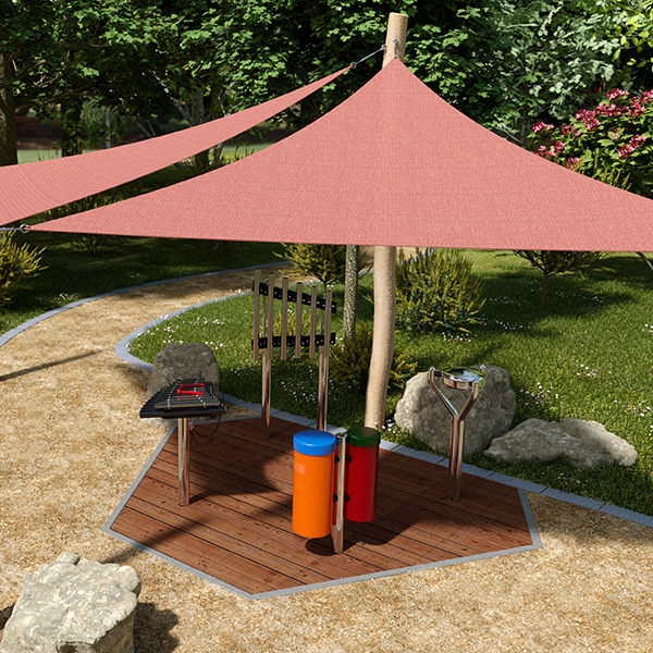 Colorful outdoor music station with a red shade sail, xylophone, and cylindrical drums, set in a lush garden path.