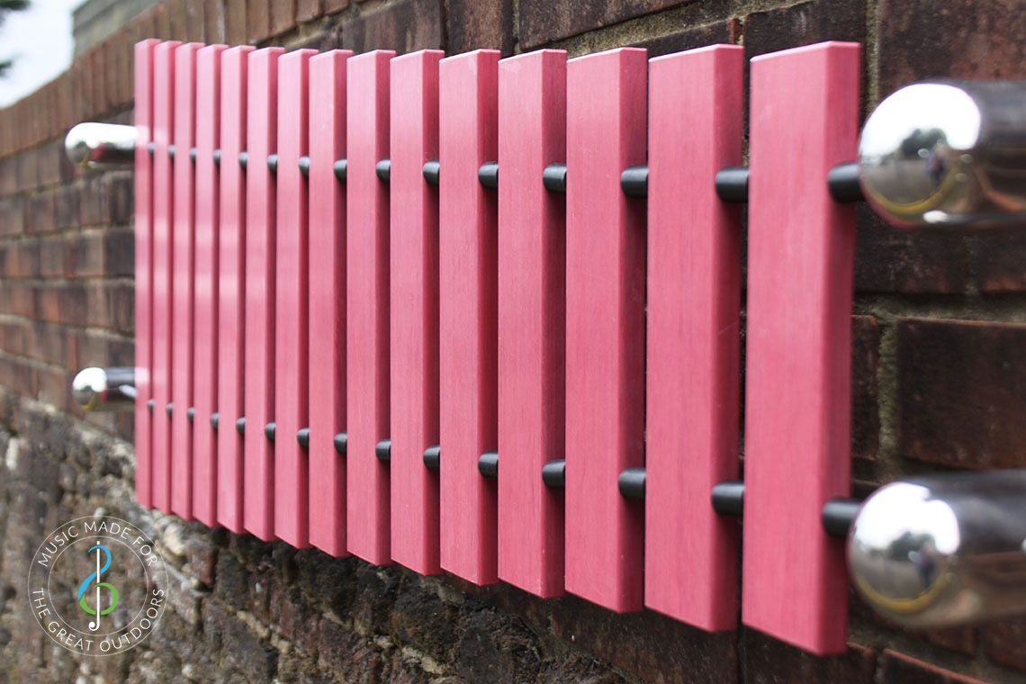 wall mounted marimba xylophone with pink notes and stainless steel fixings