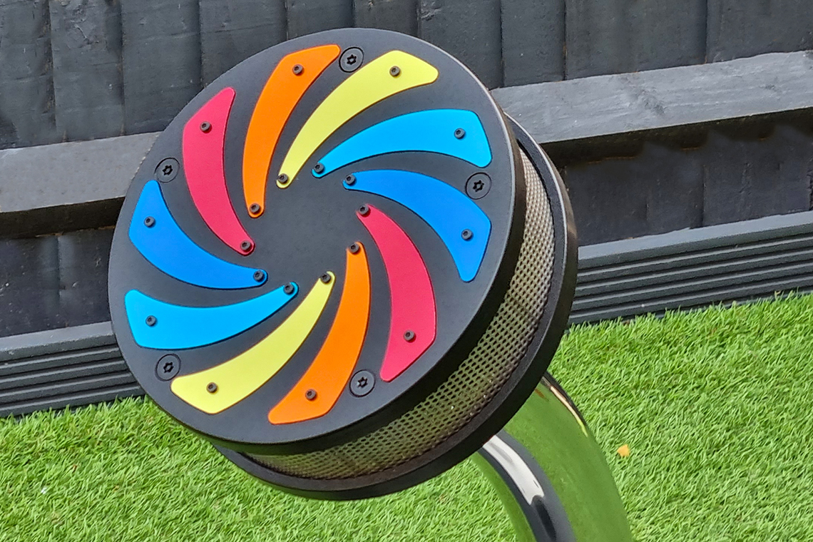 A small rain wheel with rainbow colored flashes in an early years setting